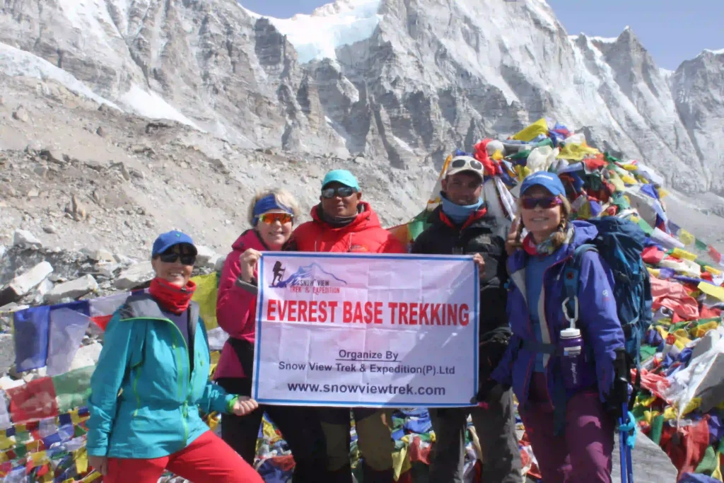 A group of trekkers along with our guide with Waterproof Jackets and Shells at the Everest Base Camp
